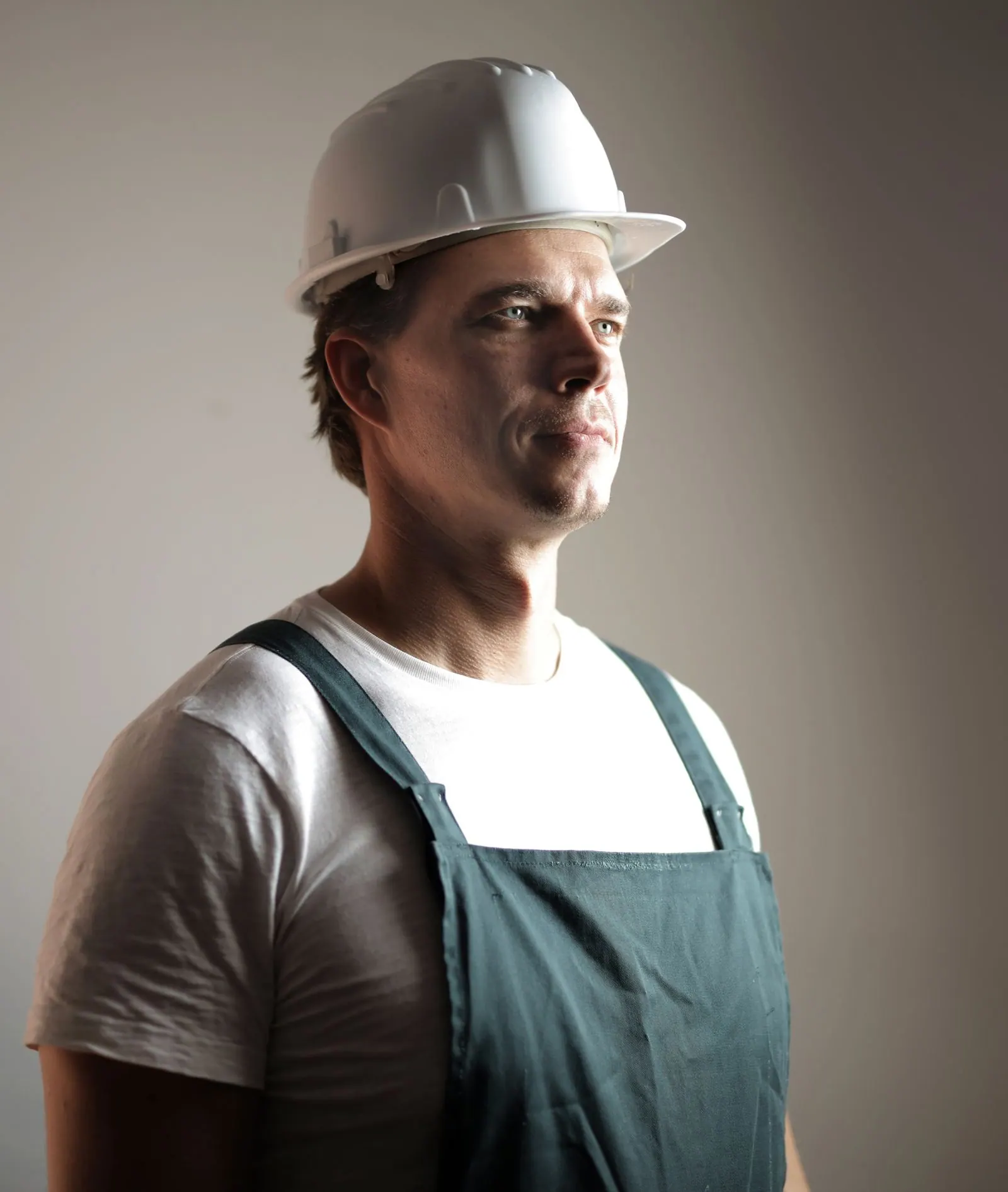 Confident worker wearing a hard hat and safety glasses